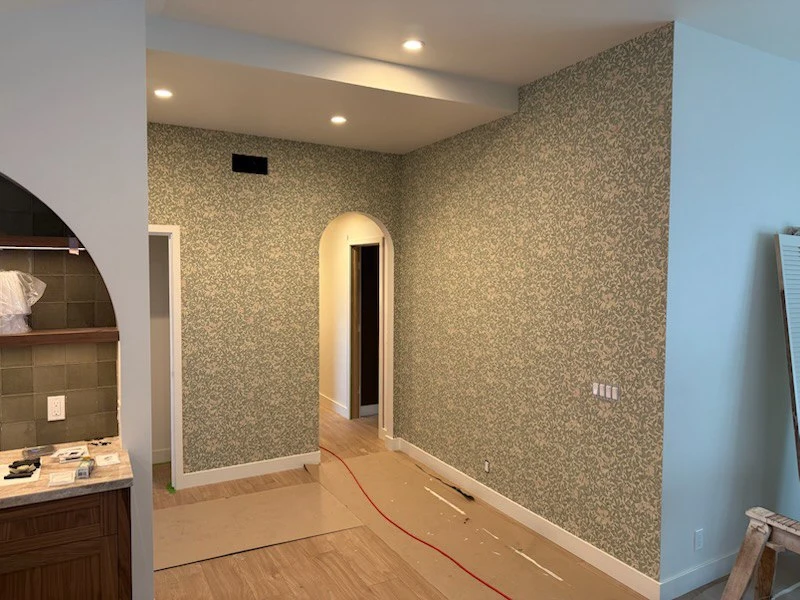 Professional wallpaper installer at work in Sweet Auburn, Atlanta